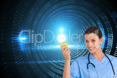 Composite image of happy surgeon holding an apple and smiling at