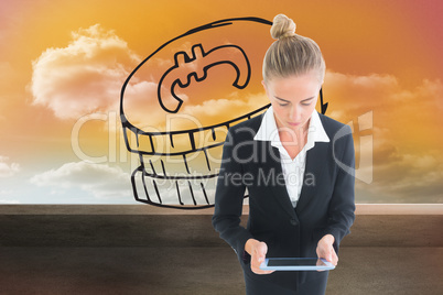 Composite image of businesswoman holding new tablet