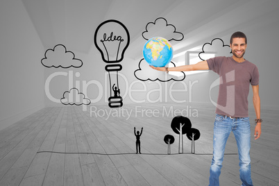 Composite image of handsome man holding out a globe