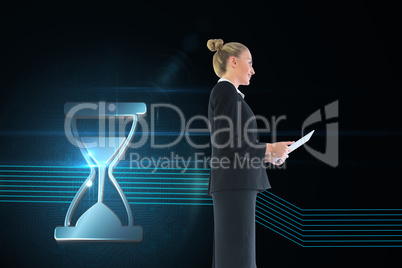 Composite image of businesswoman holding new tablet