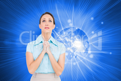 Composite image of troubled young businesswoman praying