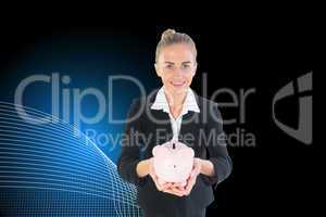 Composite image of businesswoman holding pink piggy bank