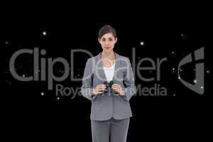 Composite image of young businesswoman with binoculars