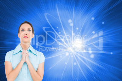 Composite image of troubled young businesswoman praying