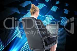 Composite image of businesswoman sitting on swivel chair with la