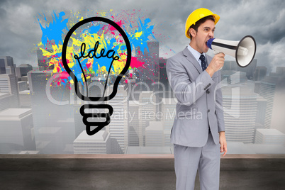 Composite image of young architect yelling with a megaphone