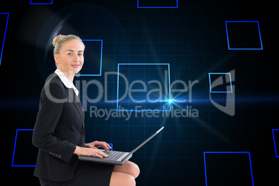 Composite image of businesswoman using laptop