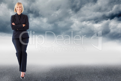 Composite image of friendly businesswoman smiling at the camera