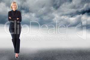 Composite image of friendly businesswoman smiling at the camera