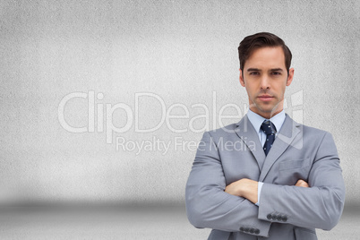 Composite image of young businessman looking at camera