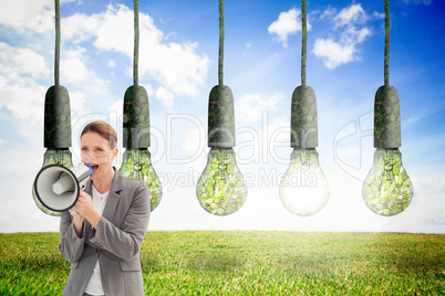 Composite image of businesswoman talking on a megaphone