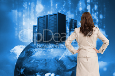 Composite image of businesswoman standing back to camera