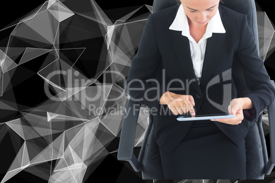 Composite image of businesswoman sitting on swivel chair with ta