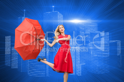 Composite image of elegant blonde holding umbrella