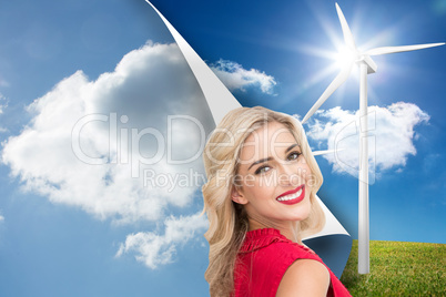 Composite image of smiling blonde standing hands on hips