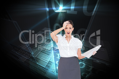 Composite image of shocked classy businesswoman holding newspape