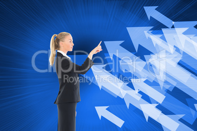 Composite image of businesswoman pointing somewhere