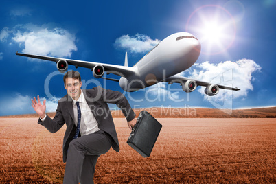 Composite image of happy businessman in a hury