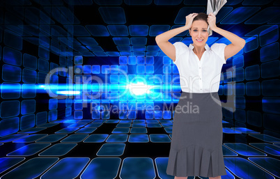 Composite image of worried stylish businesswoman holding newspap