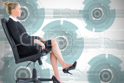 Composite image of businesswoman sitting on swivel chair in blac