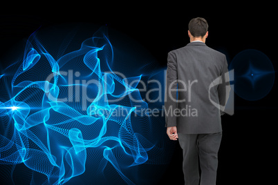 Composite image of young businessman walking away from camera