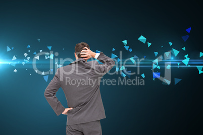 Composite image of young businessman standing back to camera scr