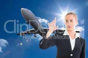 Composite image of businesswoman pointing somewhere