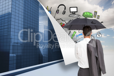 Composite image of businessman standing back to camera holding u Composite image of businessman standing back to camera holding u