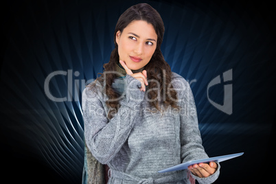 Composite image of pensive model wearing winter clothes holding