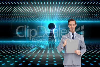 Composite image of happy businessman holding a clipboard