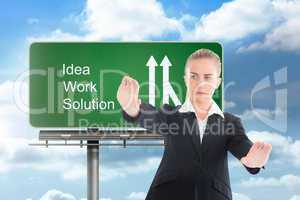 Composite image of businesswoman pointing somewhere