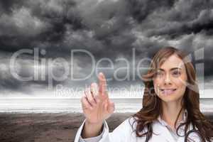 Composite image of smiling doctor pointing