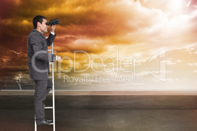 Composite image of businessman standing on ladder