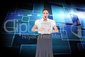 Composite image of shocked stylish businesswoman holding newspap