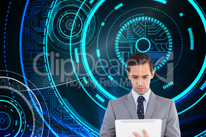 Composite image of businessman holding a tablet computer