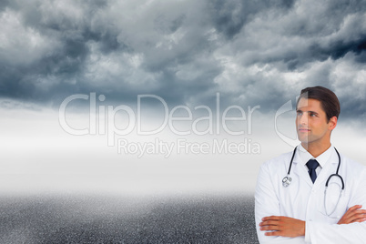 Composite image of confident doctor with arms crossed looking up