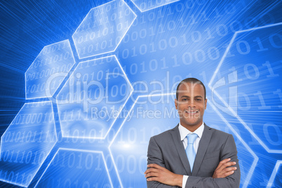 Composite image of charismatic young businessman with arms cross