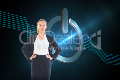 Composite image of businesswoman standing with hands on hips