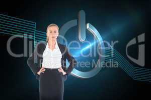 Composite image of businesswoman standing with hands on hips