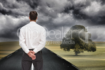 Composite image of businessman turning his back to camera