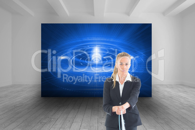 Composite image of businesswoman pulling a rope