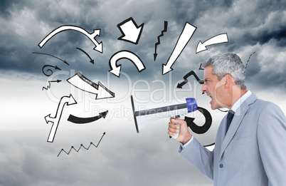 Composite image of businessman shouting in loudspeaker