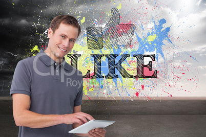 Composite image of smiling young man with tablet computer