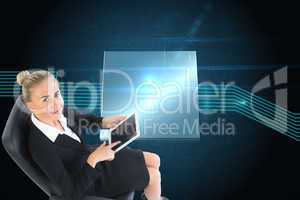 Composite image of businesswoman sitting on swivel chair with ta