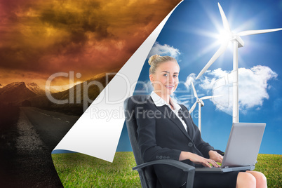 Composite image of businesswoman sitting in swivel chair with la