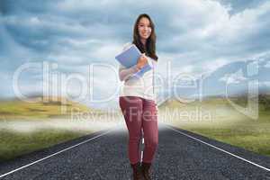 Composite image of smiling student in a computer room