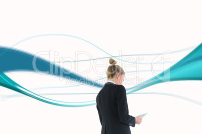 Composite image of businesswoman holding new tablet