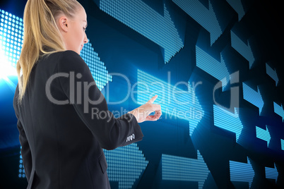 Composite image of businesswoman pointing somewhere