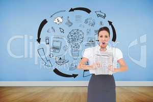 Composite image of shocked stylish businesswoman holding newspap