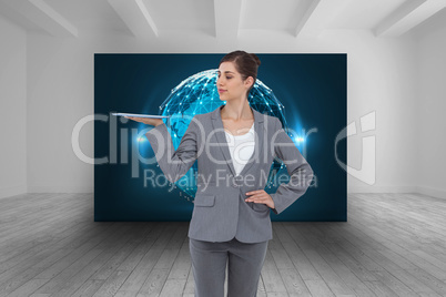 Composite image of businesswoman holding tablet computer